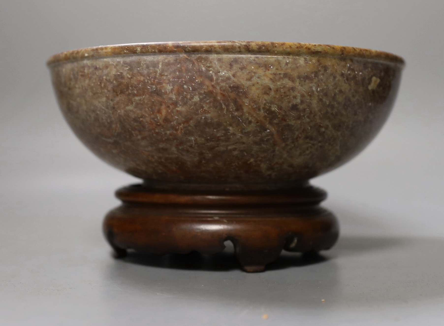 An Indo-Persian engraved copper plated tea caddy and Chinese soapstone bowl on stand. Diameter of bowl 20.5cm